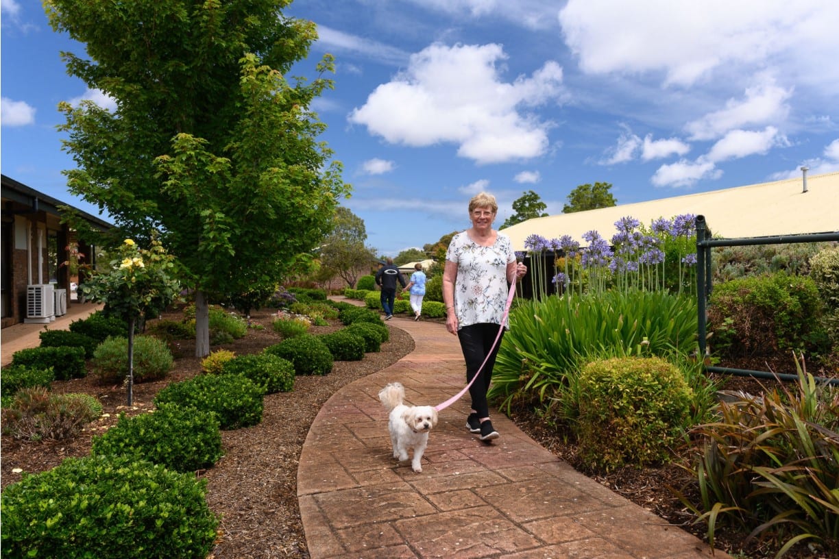 Woman walking dog