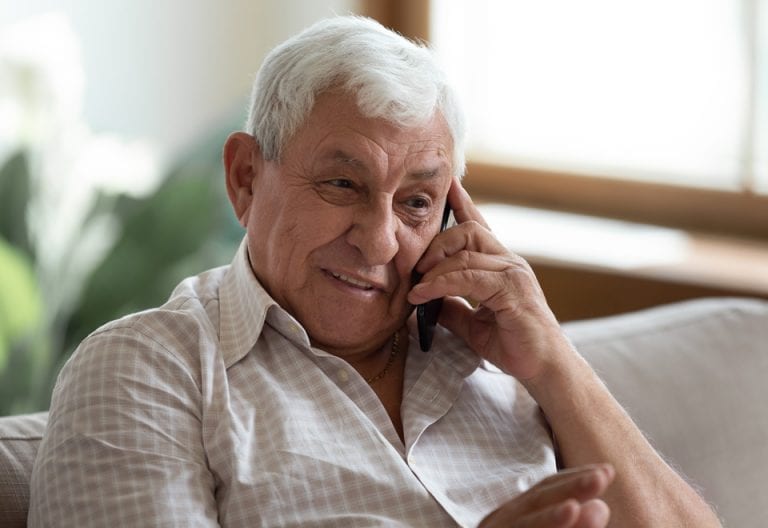 Older gentleman having a conversation over the phone