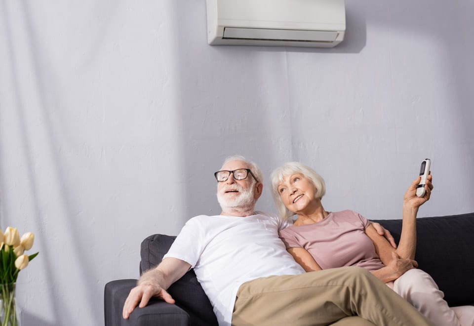 Couple enjoying air conditioning in the summer 