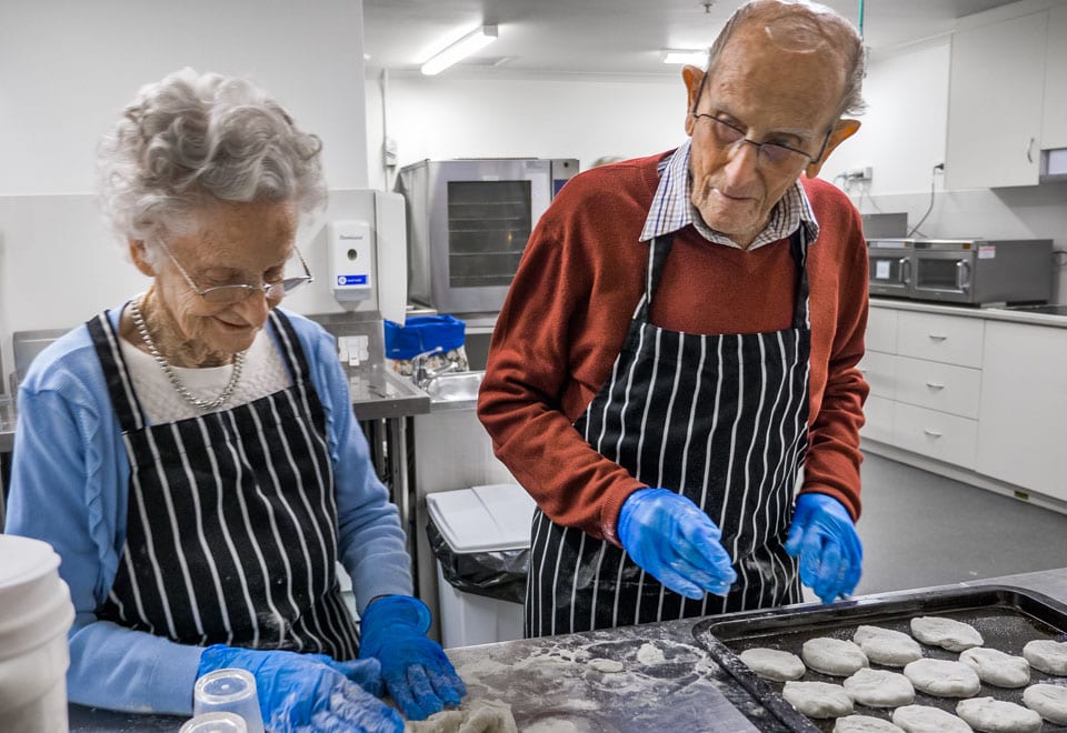 Yvonne and Fred are making scones at ACH Group Kapara nursing home