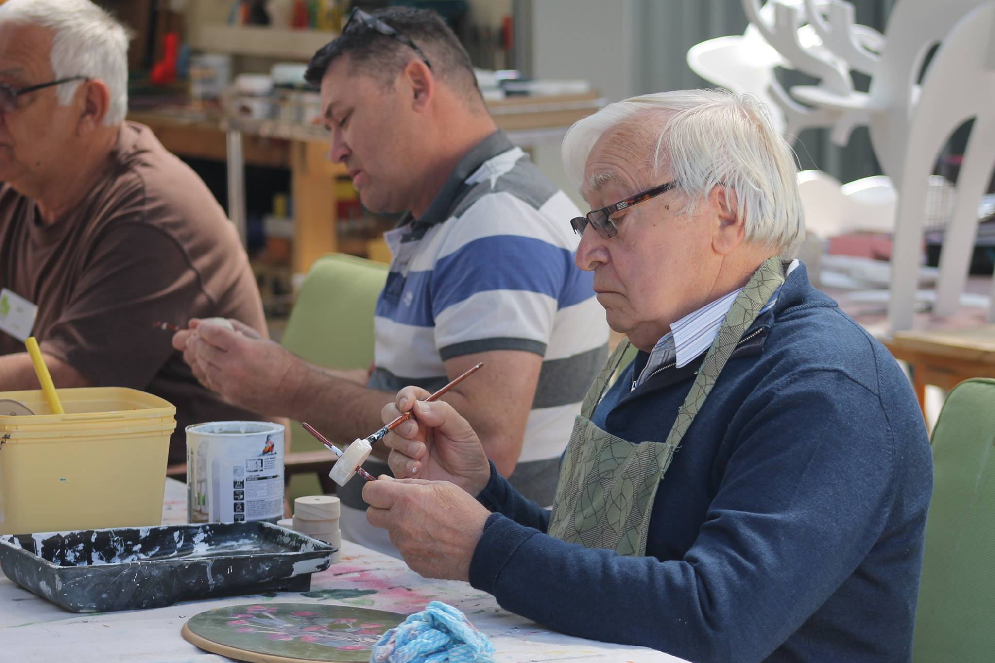 Port Noarlunga residential care home resident at painting workshop