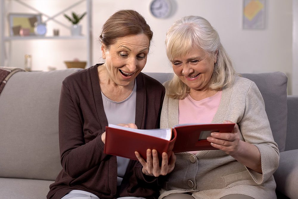 Two women looking at a photo album