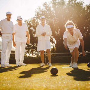 A group of people playing lawn bowls