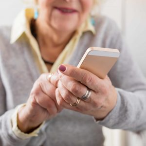 Older woman looking at phone
