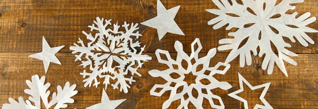 winter wonderland, with paper snowflakes on table