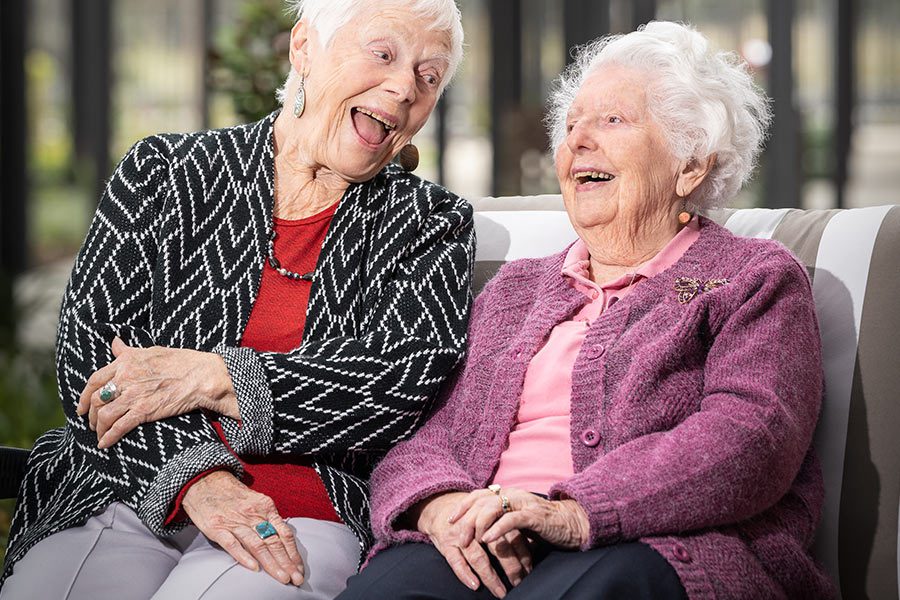 Jean and Rose, friends who now live at Healthia, having a laugh.