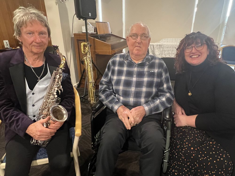 Kym, Robert and Charissa, posing for a photo marking Autumn Leaves performance.