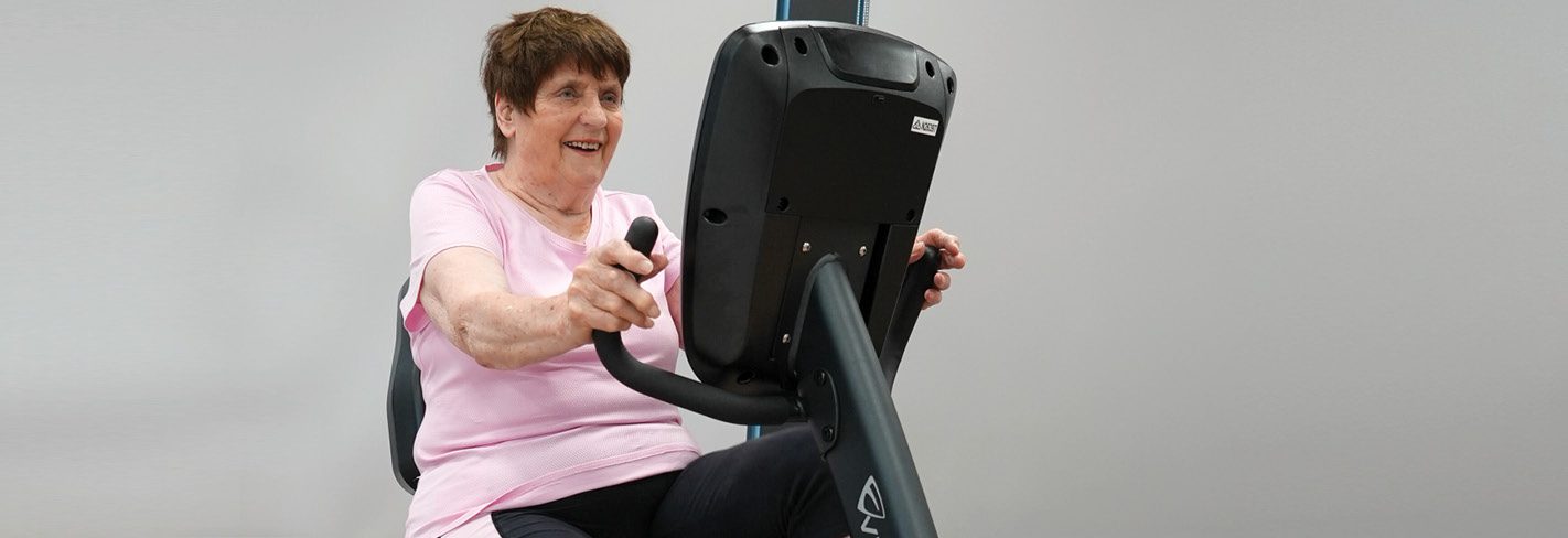 Betty attends ACH Group's Health Studio twice a week, pictured here on an exercise bike.