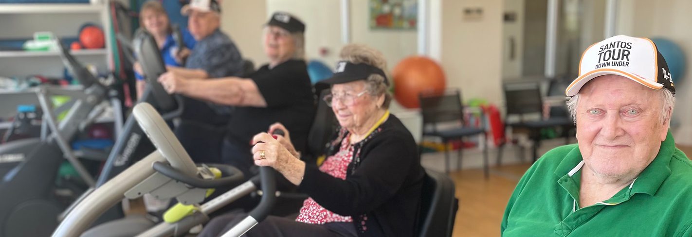 Cycling challenge at Milpara Residential Care Home, with residents engaging in exercise in the gym