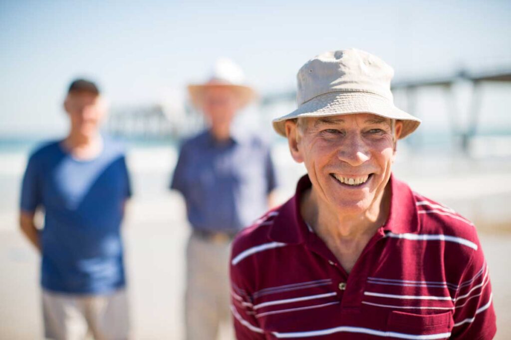 Group of men walking on the beach