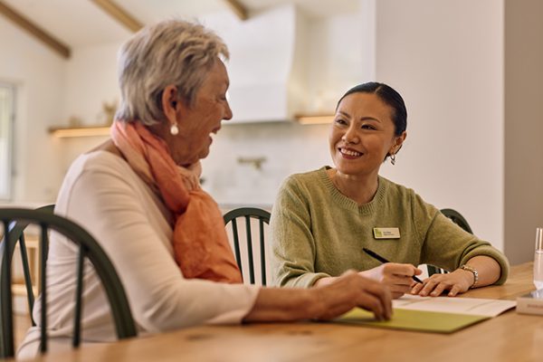 Customer and ACH Group support worker discussing support at home
