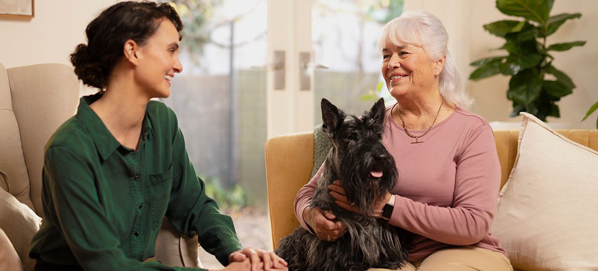 Support at home with ACH Group - a support worker having a chat with a customer