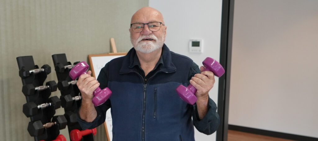 Brian Harris is a resident leader, and Health Studio Customer - here pictured with weights at Health Studio Rostrevor