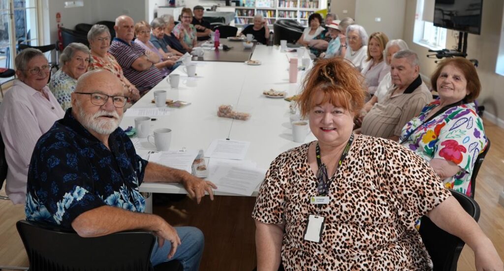 Brian with Lili, Village Manager and residents at St Georges Court information session about the program