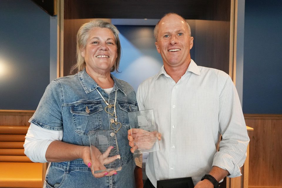 Amy and Michael holding their trophy