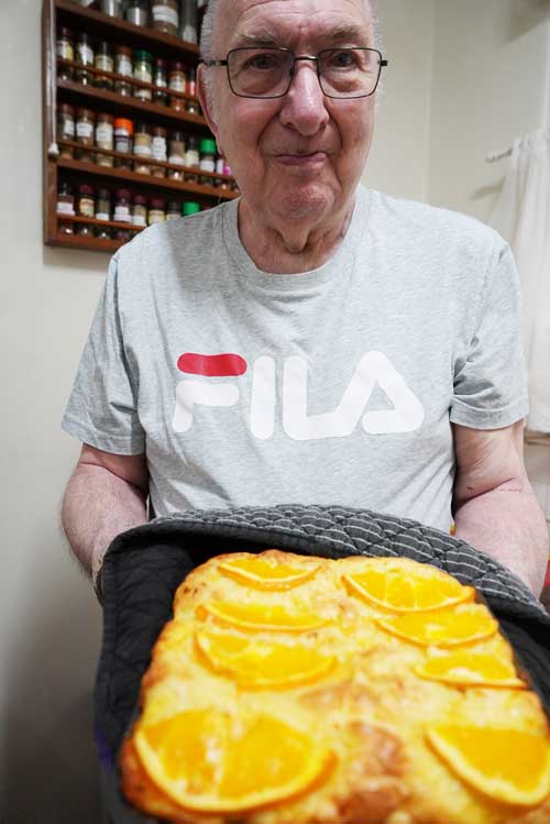 John showing his amazing orange cake