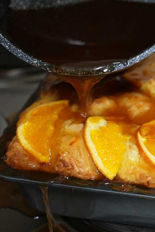 The best part! Pouring over the cooled syrup for the final part of baking an orange cake.