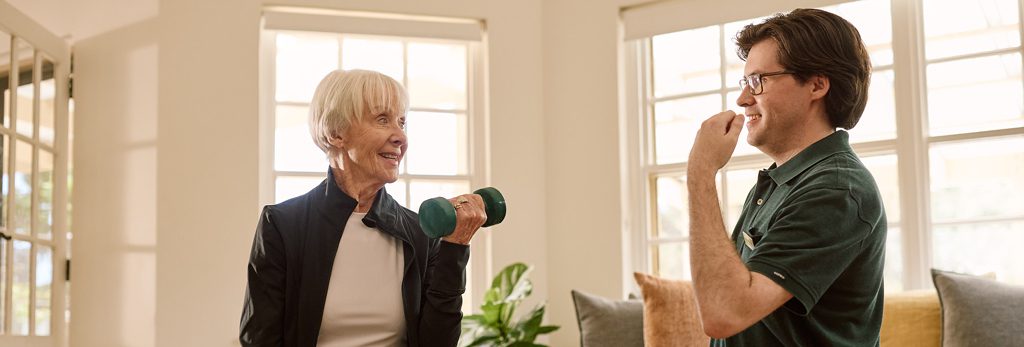 Customer engaging in a personalised health program with ACH Group's exercise physiologist, support at home