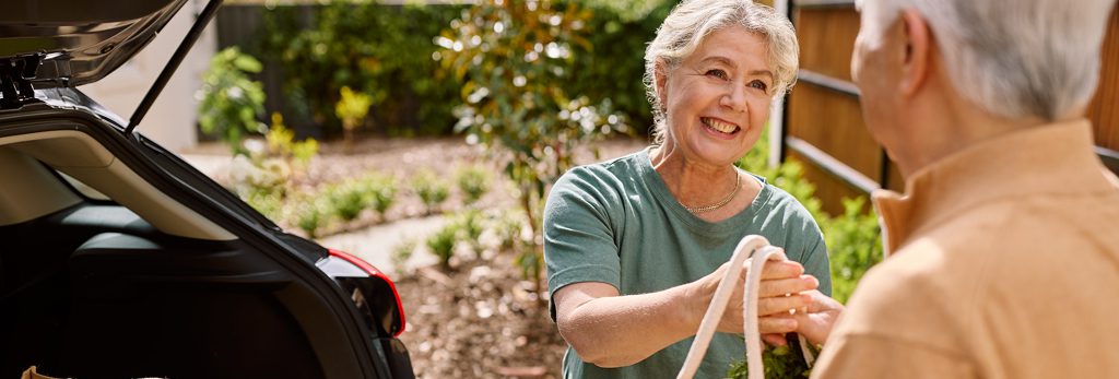 Support worker assisting with shopping, ACH Group support at home program